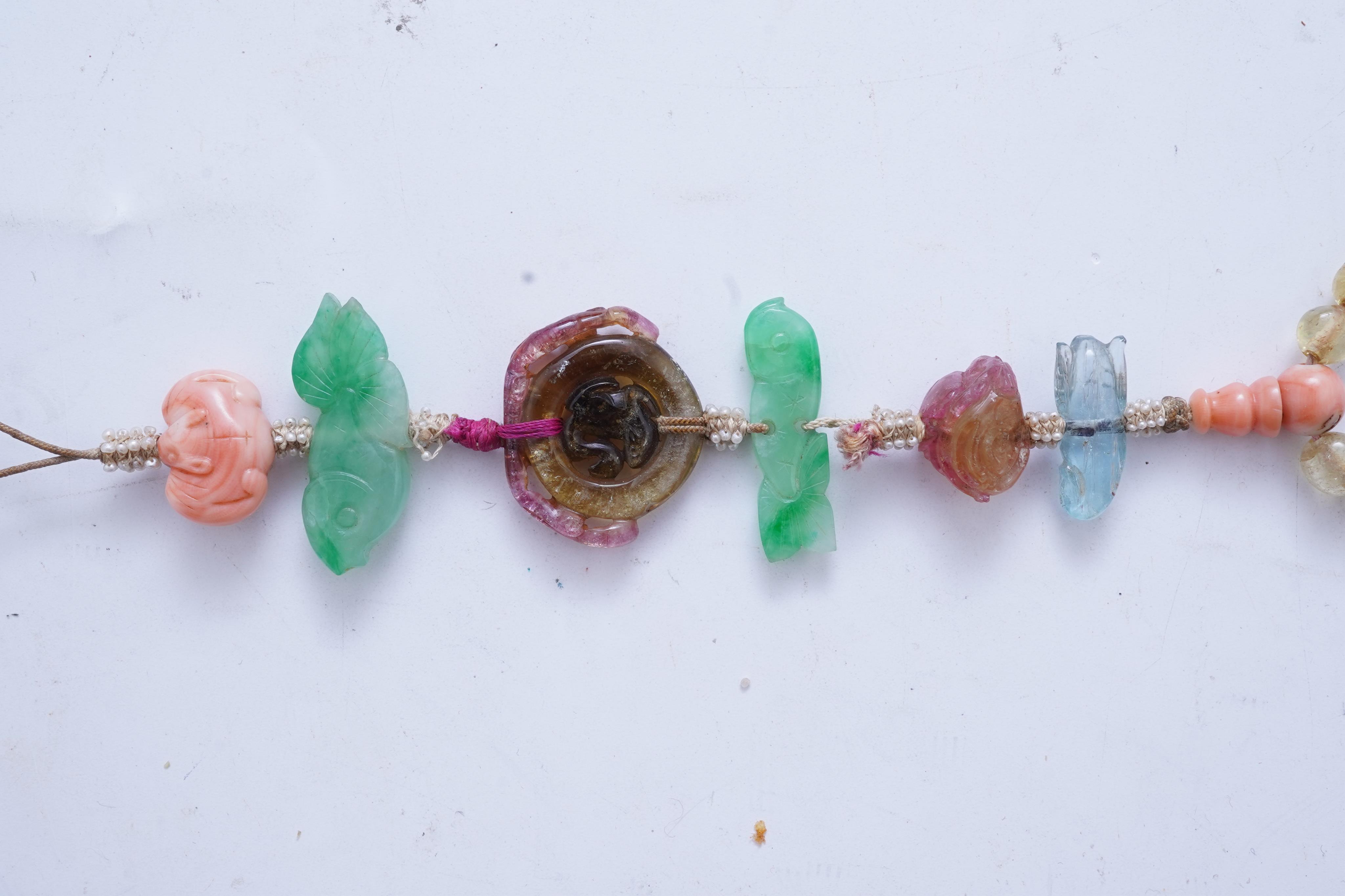 A multi-gem, coral and seed pearl necklace, China, early 20th century